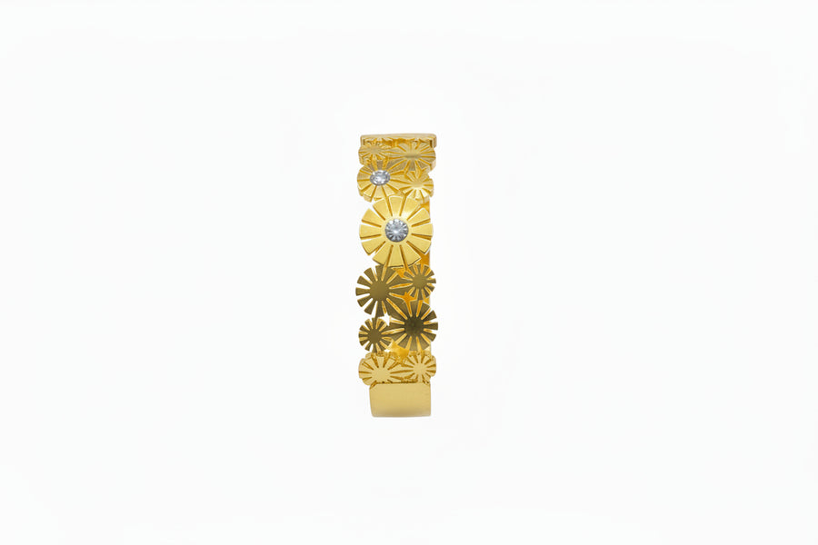 Sunflower motif openable kada with solitaire centres in gold finish held in hand