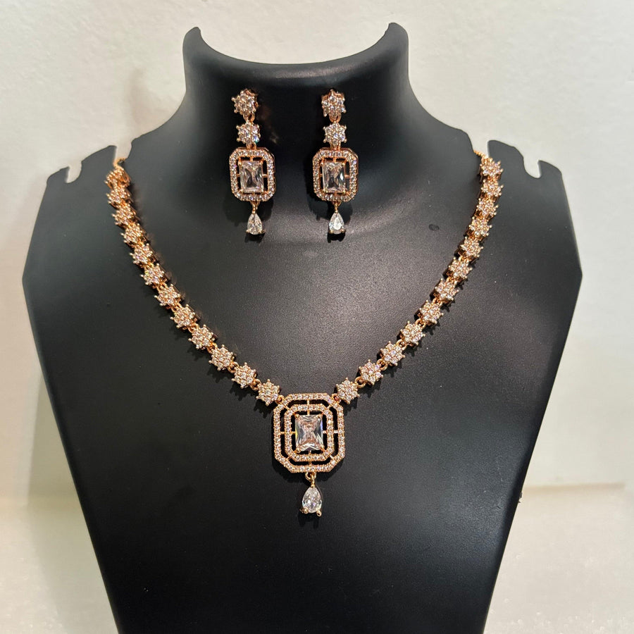 Gold-tone AD CZ geometric pendant necklace set with matching drop earrings