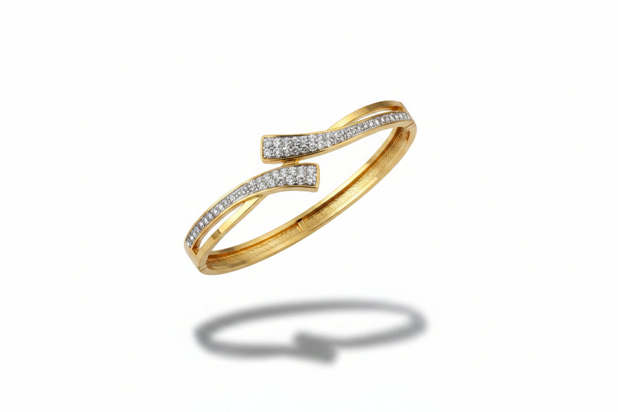 Criss-cross zircon openable kada in gold finish held in hand