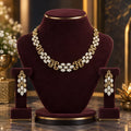 Premium AD CZ floral lattice necklace set with matching drop earrings on a burgundy jewellery display