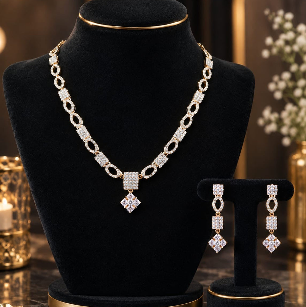 Premium AD CZ oval-link necklace set with matching drop earrings on a black jewellery display