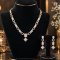 Premium AD CZ oval-link necklace set with matching drop earrings on a black jewellery display