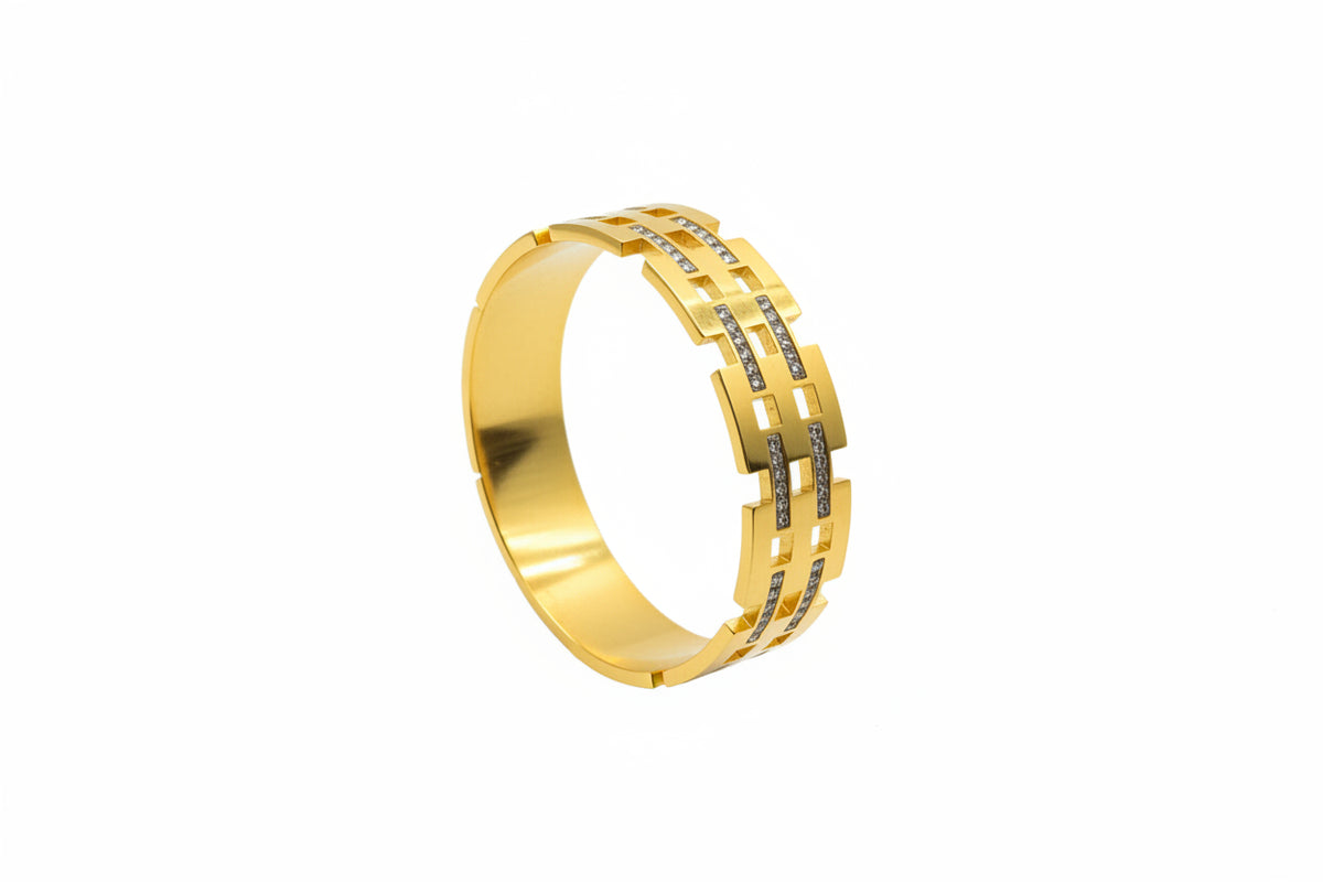 Brick link openable kada with baguette zircon in gold finish held in hand