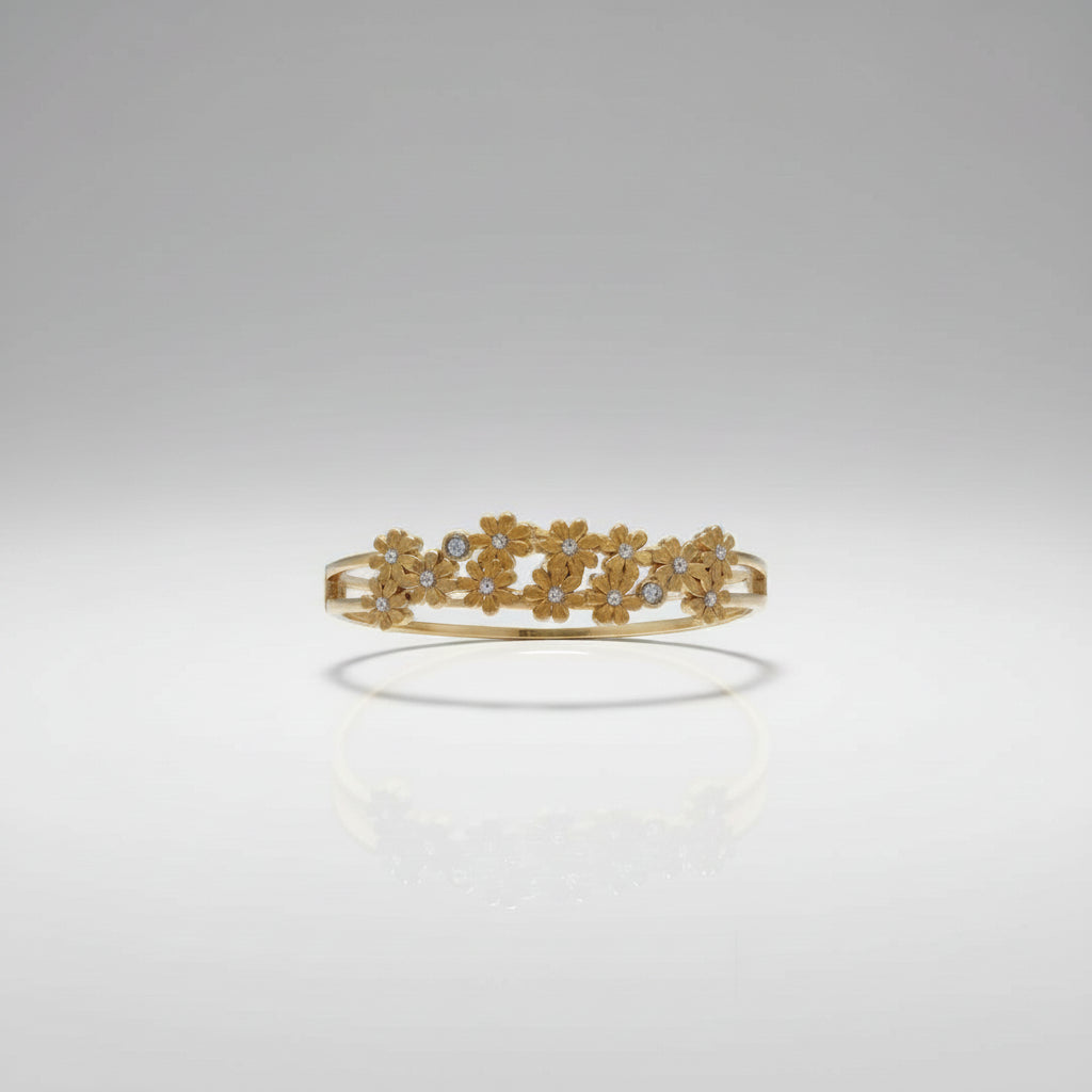 Floral cluster openable kada in dual-tone gold finish held in hand