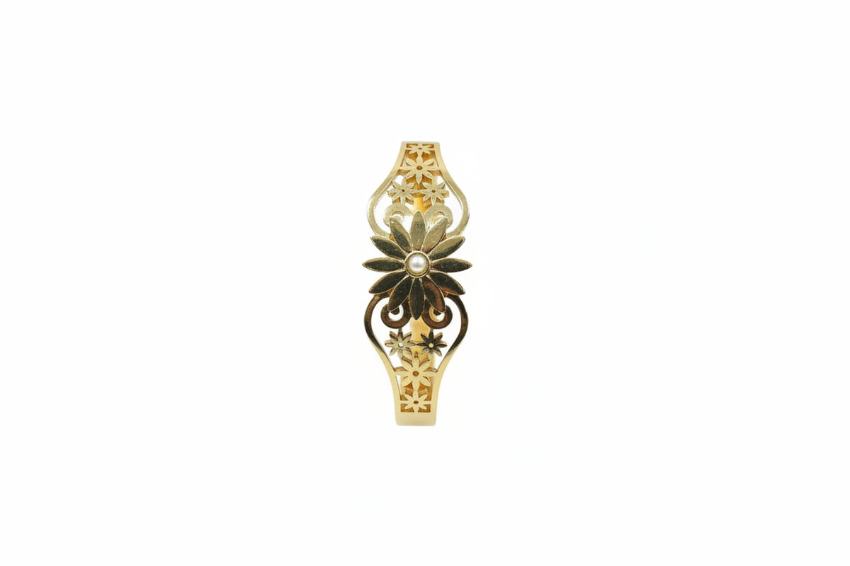 Lotus motif openable kada in gold finish held in hand