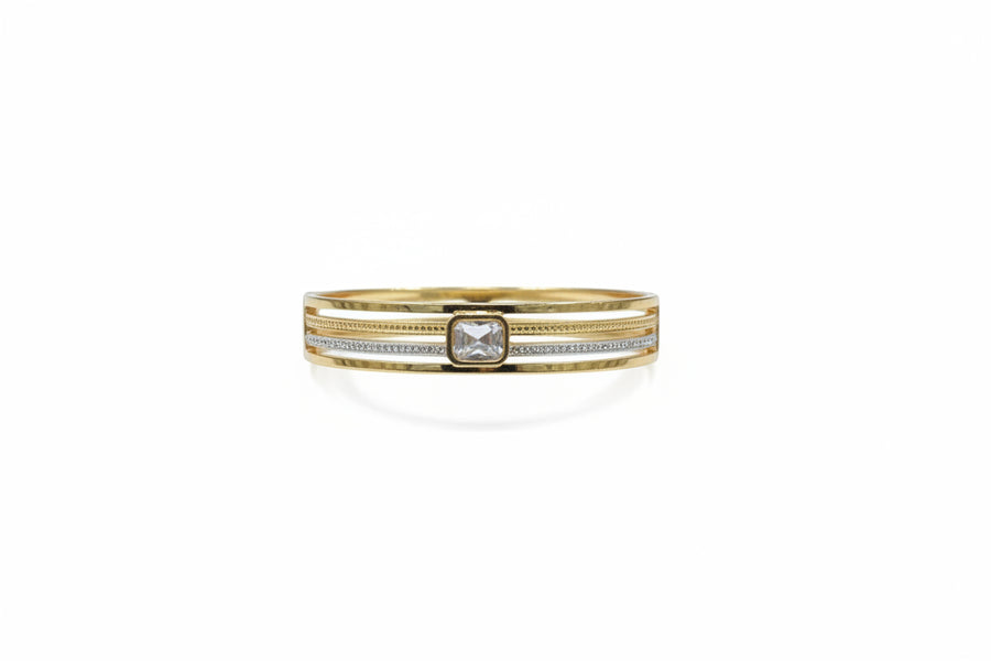 Baguette zircon openable kada with solitaire centre in gold finish held in hand