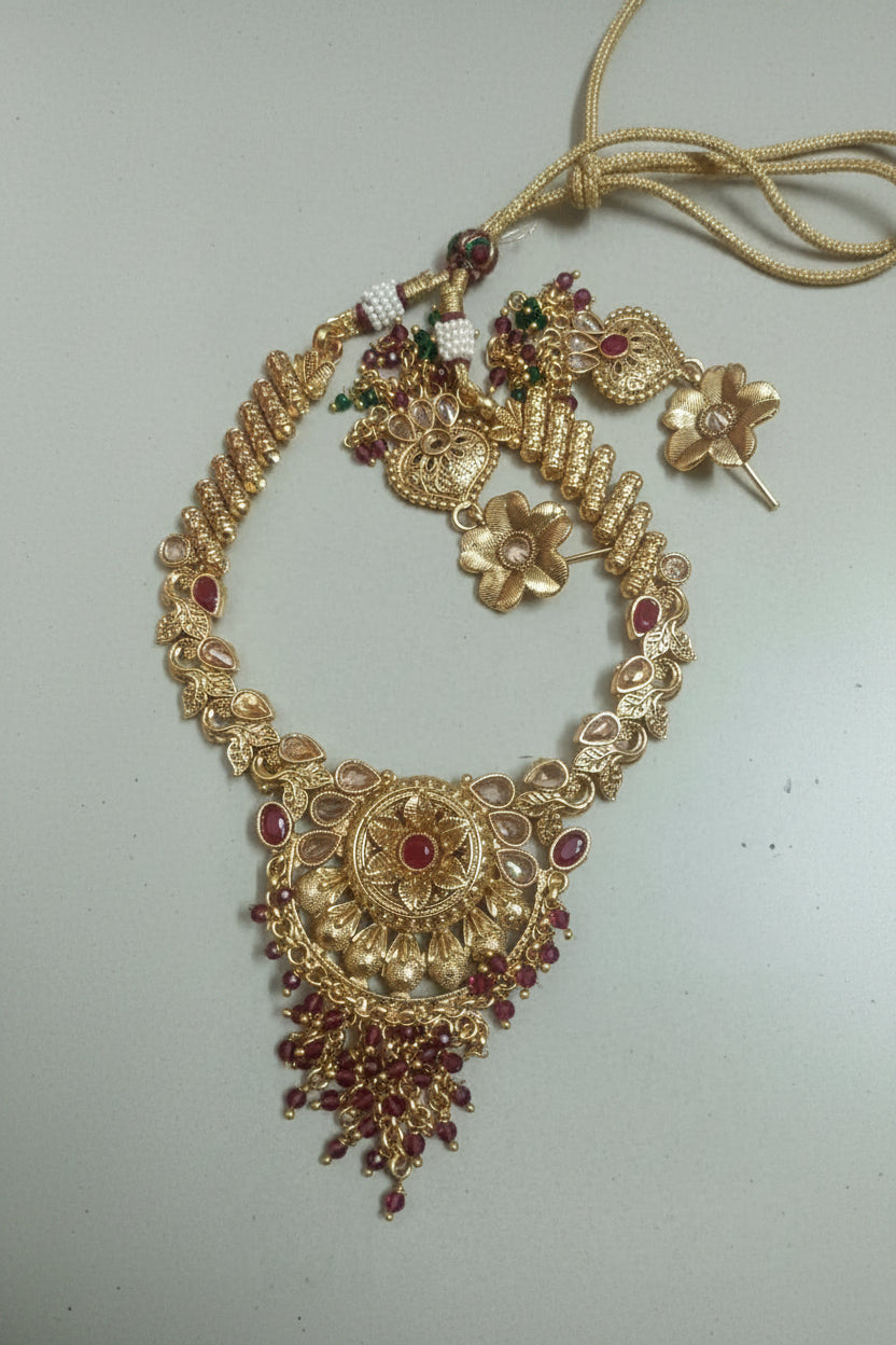 Kundan Ruby Circular Pendant Necklace Set with Lotus Earrings