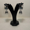 Premium oxidised peacock jhumka earrings with blue and green peacock-inspired stones and bead drops