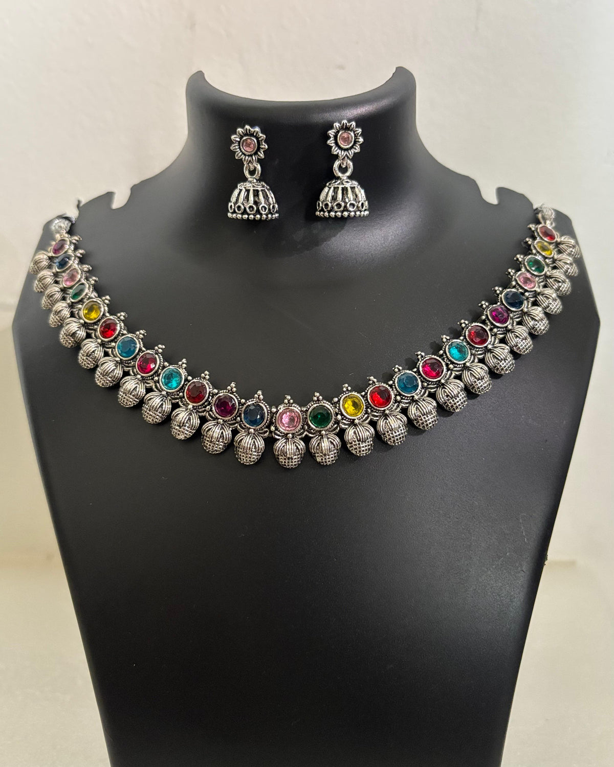 Oxidised necklace set with multicolour stones, textured dangling drops and matching jhumka earrings