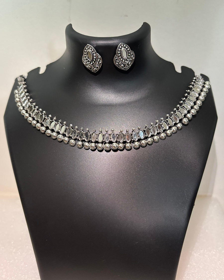 Oxidised necklace set with oval mirror-style stones, bead drops and matching stud earrings