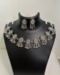 Oxidised teardrop tassel necklace with floral motifs, bead drops and matching teardrop earrings