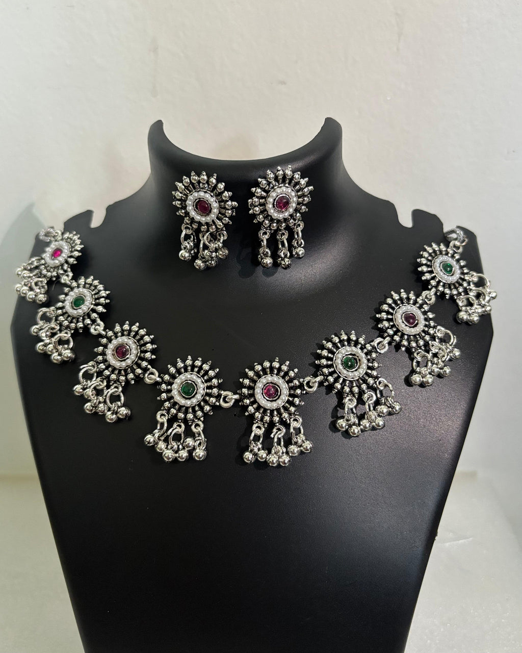Oxidised floral stone tassel necklace with colourful centre stones and matching floral drop earrings