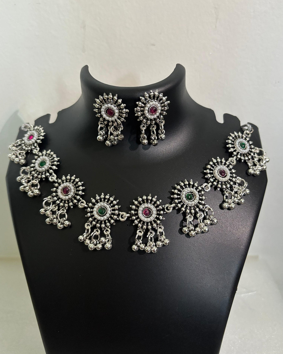 Oxidised floral stone tassel necklace with colourful centre stones and matching floral drop earrings