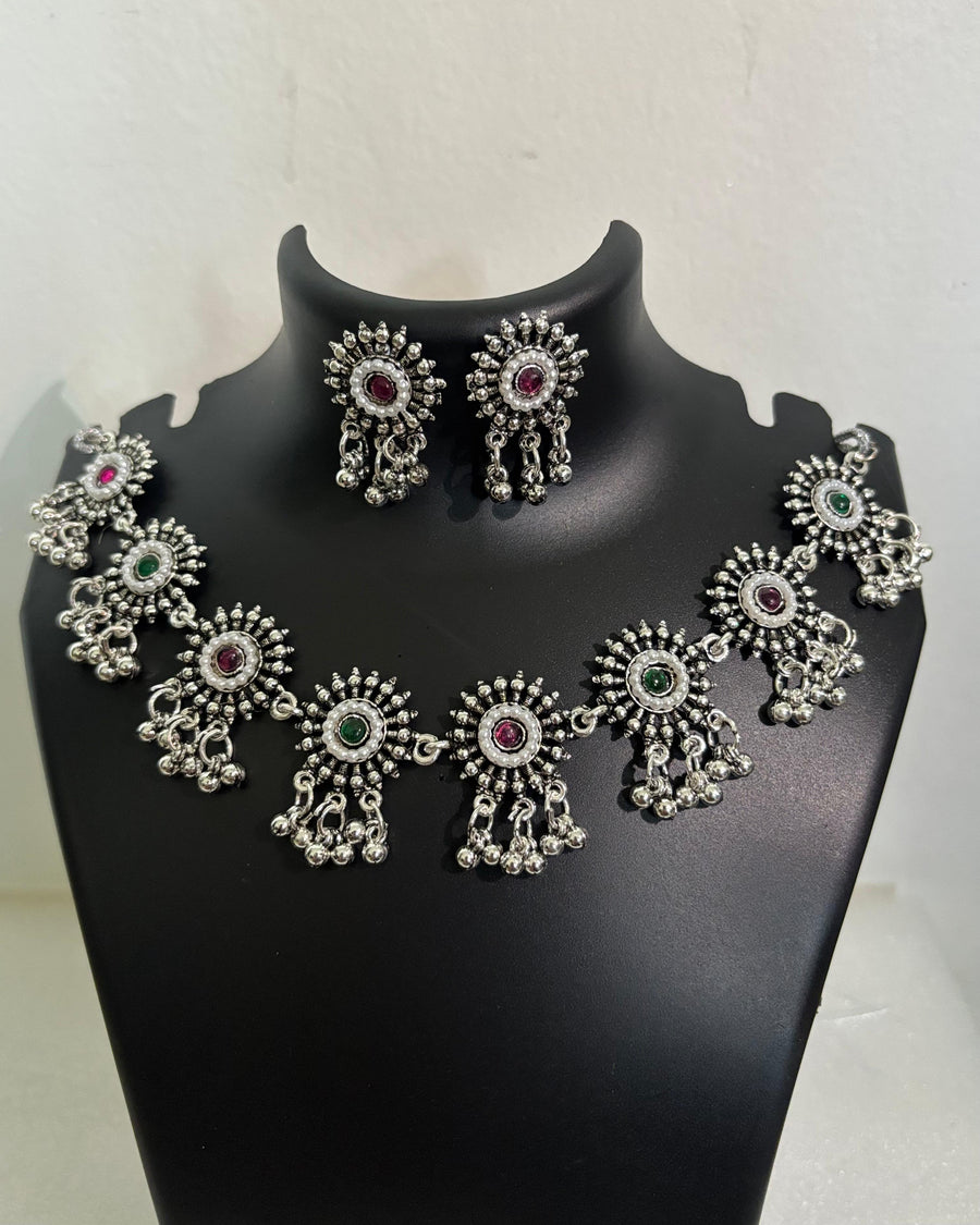 Oxidised floral stone tassel necklace with colourful centre stones and matching floral drop earrings