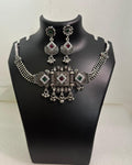 Oxidised statement choker necklace with geometric motifs, colourful stones, tassels and matching floral drop earrings