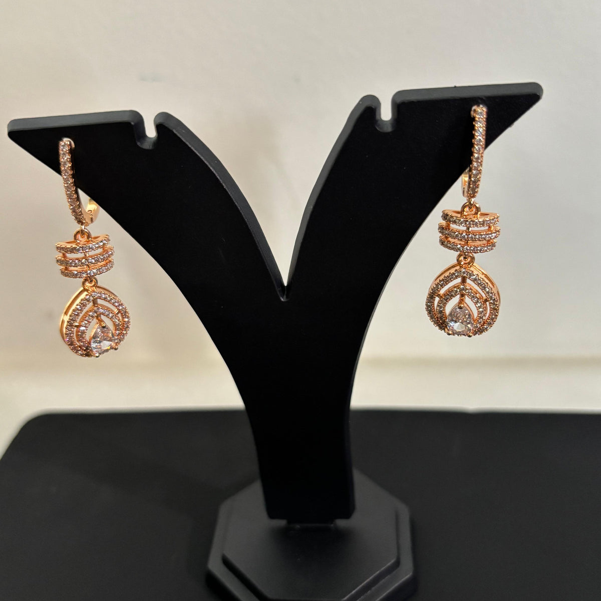 Premium anti-tarnish AD CZ teardrop drop earrings with sparkling stones in a gold-tone setting