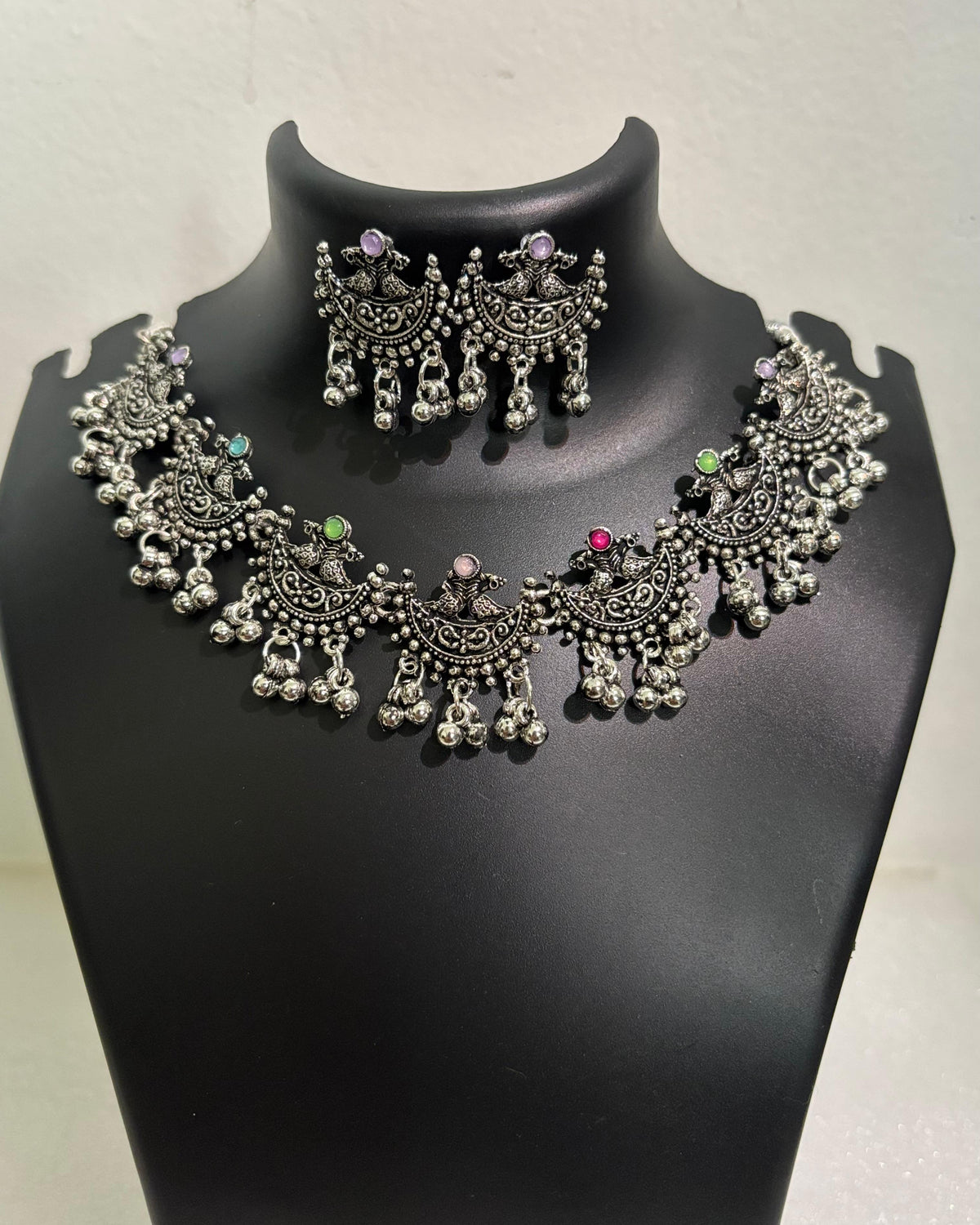 Oxidised crescent tassel necklace with colourful stone accents and matching crescent drop earrings