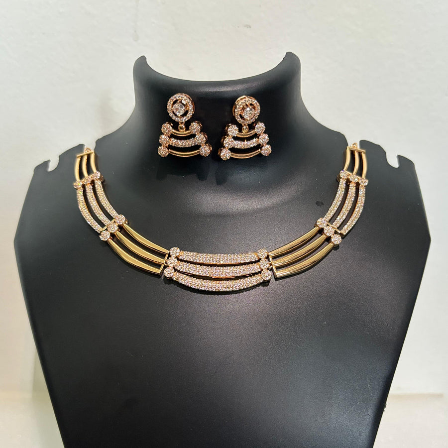 Gold-tone AD CZ triple layer necklace set with matching stone-detailed earrings