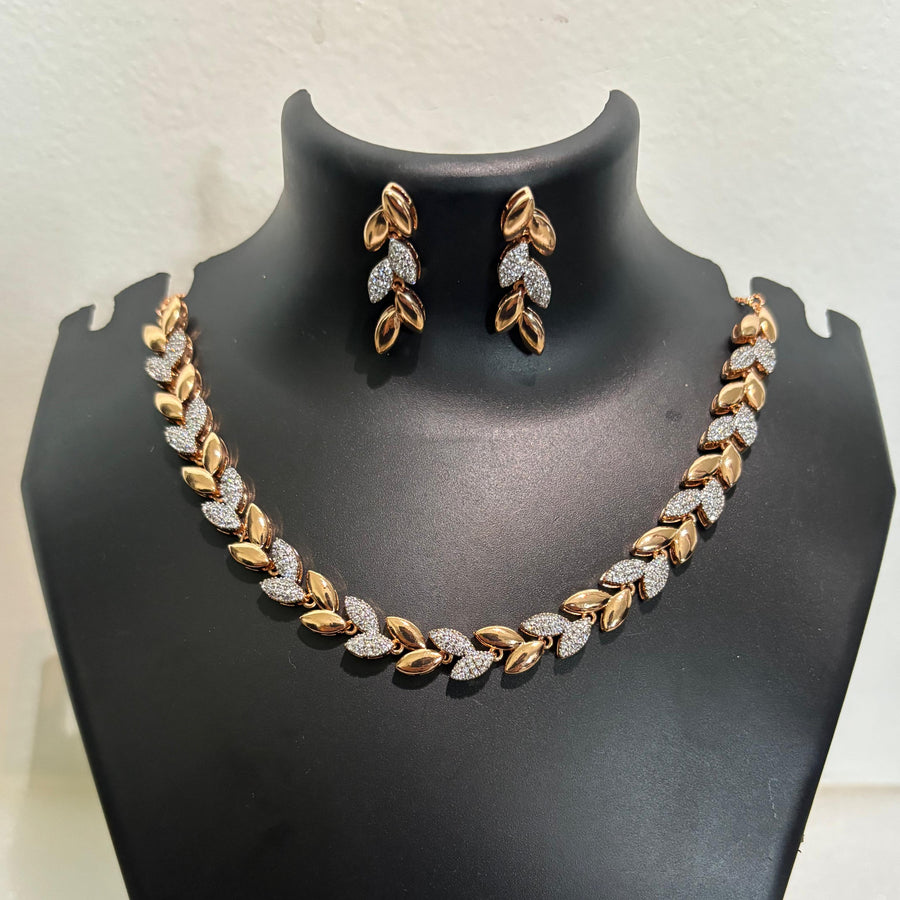 Gold-tone AD CZ leaf-link necklace set with matching leaf-inspired earrings