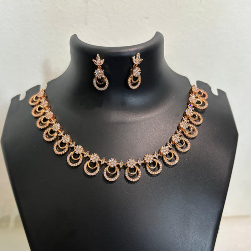 Gold-tone AD CZ circular-link necklace set with matching loop-inspired earrings
