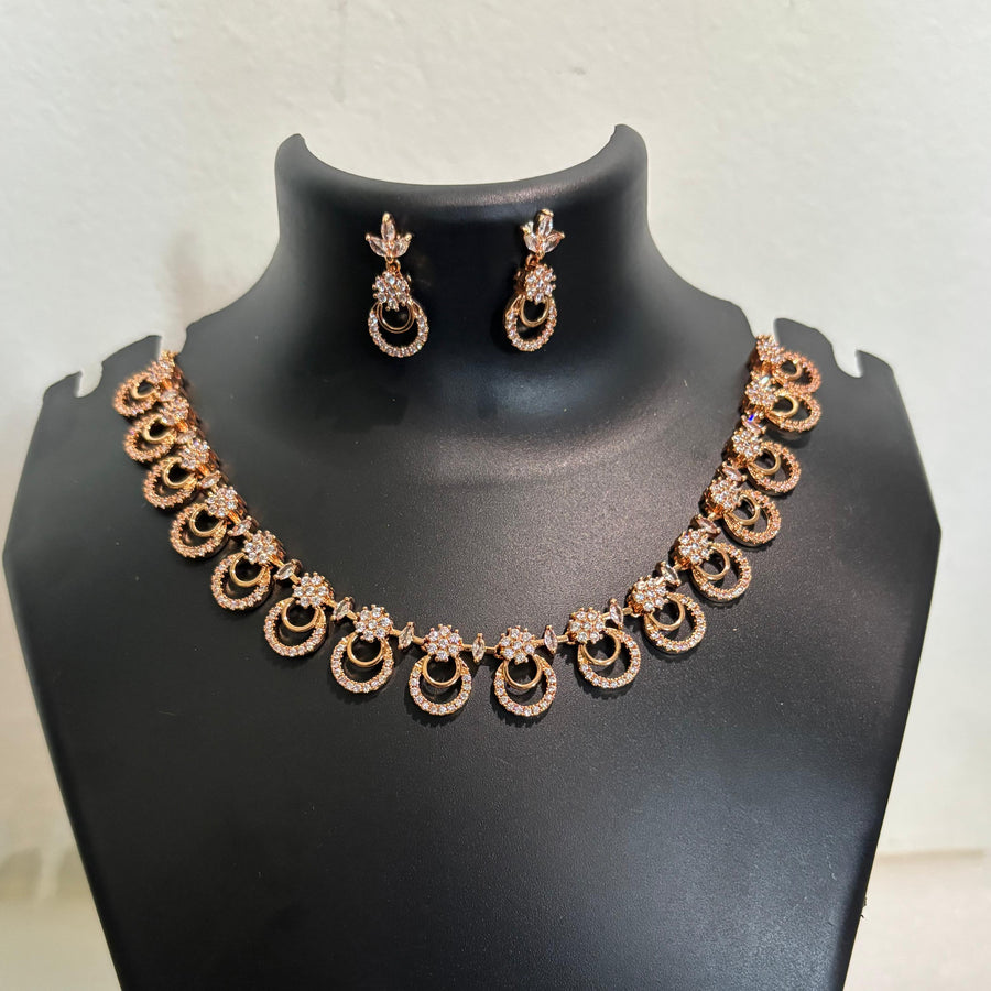 Gold-tone AD CZ circular-link necklace set with matching loop-inspired earrings
