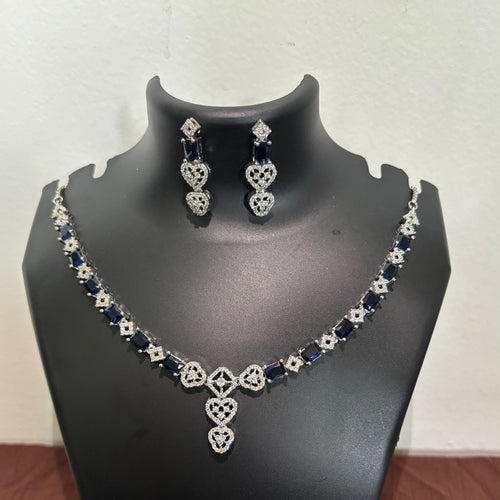 Gold-tone AD blue heart pendant necklace set with matching heart-detail earrings
