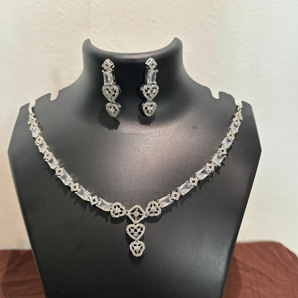 Silver-tone AD heart drop necklace set with matching heart-detail earrings