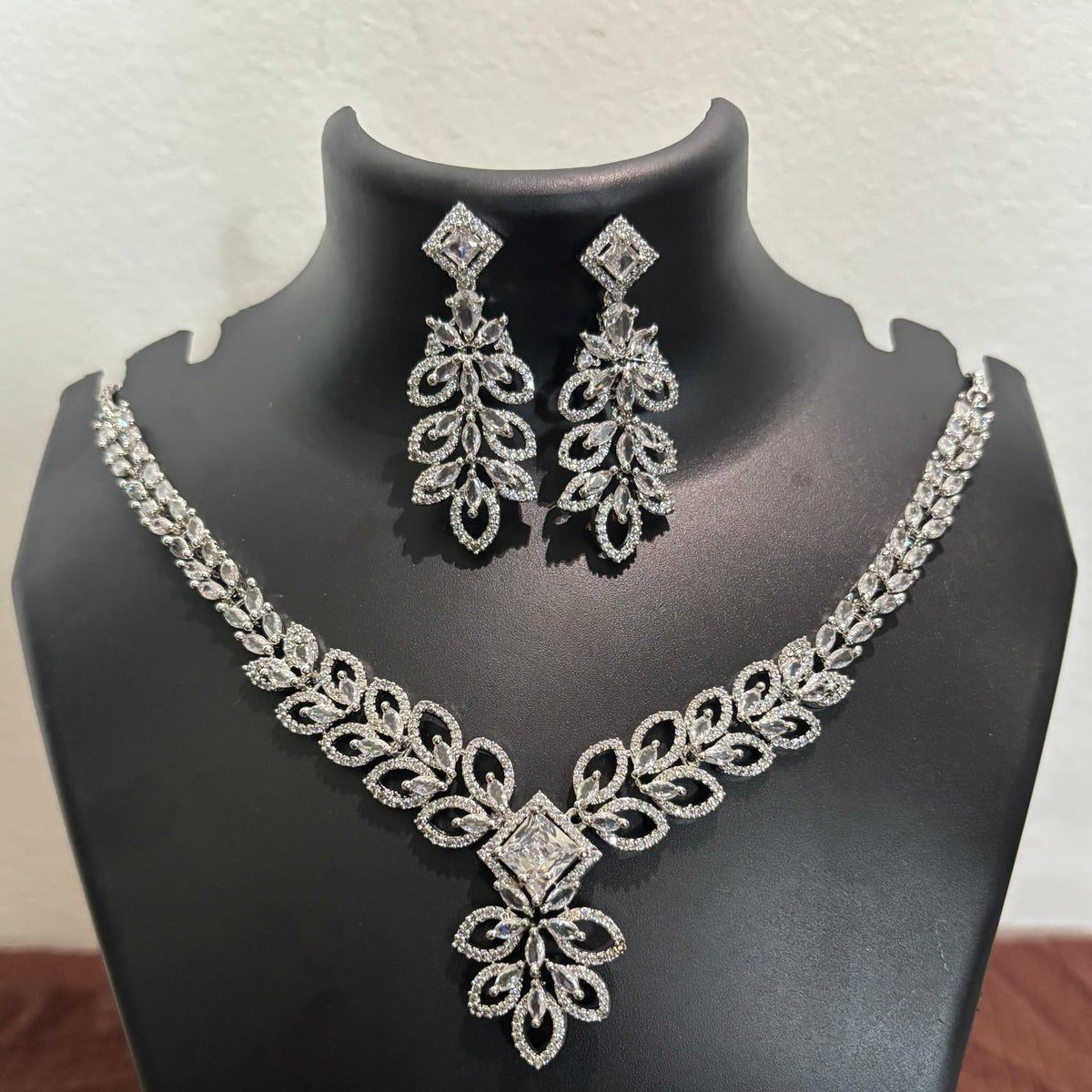 Silver-tone premium AD floral leaf necklace set with matching long-drop earrings