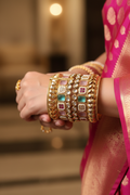 Woman wearing Kundan Multistone Wide Cuff Bangle